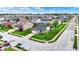 Picturesque aerial shot of a vibrant residential neighborhood with well-kept homes and verdant landscaping at 2201 Schoolmarm Dr, Greenfield, IN 46140