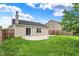 This backyard features a patio and lawn at 2201 Schoolmarm Dr, Greenfield, IN 46140