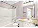 This bathroom features a shower-tub, toilet, and vanity with mirror at 2201 Schoolmarm Dr, Greenfield, IN 46140