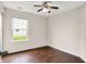This bedroom features a ceiling fan, large window and neutral color palette, ready to be designed to your preferences at 2201 Schoolmarm Dr, Greenfield, IN 46140