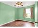 Serene bedroom featuring a window letting in natural light and wood-look flooring at 2201 Schoolmarm Dr, Greenfield, IN 46140