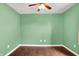 Spacious bedroom featuring hardwood floors and a ceiling fan at 2201 Schoolmarm Dr, Greenfield, IN 46140