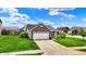 Beautiful home with a brick facade, two-car garage, and manicured lawn, offering excellent curb appeal at 2201 Schoolmarm Dr, Greenfield, IN 46140