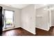 Bright nook area features hardwood floors and a large window with charming curtains, complemented by neutral walls at 2201 Schoolmarm Dr, Greenfield, IN 46140