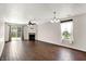 Open living room featuring a fireplace, ceiling fan, and sliding glass doors leading to the backyard at 2201 Schoolmarm Dr, Greenfield, IN 46140