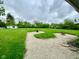 A stone patio and gravel area in the backyard creates a charming outdoor living space at 2221 E 35Th St, Anderson, IN 46013