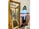 Bathroom featuring a tiled shower, patterned floors, pink tiled walls, and a window at 2221 E 35Th St, Anderson, IN 46013