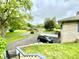 Home exterior view showcases driveway, front yard, landscaping, and neighborhood at 2221 E 35Th St, Anderson, IN 46013