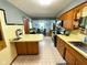 View of the kitchen and dining area with wooden cabinets, and stainless steel appliances at 2221 E 35Th St, Anderson, IN 46013