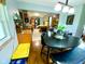 A dining area with a view into the kitchen, enhanced by natural light, offers a cozy place to eat at 2221 E 35Th St, Anderson, IN 46013