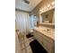 Clean bathroom featuring a shower, vanity with a sink, and tiled floors at 2508 Pamela Ct, Anderson, IN 46012