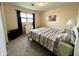 Comfortable bedroom with neutral walls, a window for natural light, and essential furnishings for relaxation at 2508 Pamela Ct, Anderson, IN 46012
