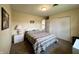 Bright bedroom with neutral walls and a comfortable bed, closet and view into a common area at 2508 Pamela Ct, Anderson, IN 46012