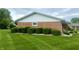 Charming brick home exterior with manicured green bushes adding to the curb appeal at 2508 Pamela Ct, Anderson, IN 46012
