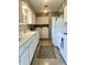 This kitchen combines functionality and convenience with a washer and dryer discreetly placed, maximizing space at 2508 Pamela Ct, Anderson, IN 46012
