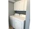 Washer and dryer set with ample cabinet space above for storage and organization at 2508 Pamela Ct, Anderson, IN 46012
