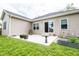 Backyard patio with room for entertaining, sliding glass doors, and a garden at 2686 Lafayette Ave, Columbus, IN 47201