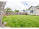 Large backyard with grass area and wood privacy fence at 2686 Lafayette Ave, Columbus, IN 47201