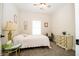 Comfortable bedroom featuring a white metal bed frame, window, and wooden dresser on neutral carpeting at 2686 Lafayette Ave, Columbus, IN 47201