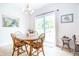 Bright dining area with round table and stylish light fixture at 2686 Lafayette Ave, Columbus, IN 47201