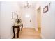 Inviting foyer with light wood floors and stylish decorative table at 2686 Lafayette Ave, Columbus, IN 47201