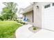 Charming front porch featuring blue chairs and manicured landscaping at 2686 Lafayette Ave, Columbus, IN 47201