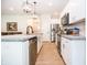 Spacious kitchen with stainless steel appliances, white cabinets, and concrete countertops at 2686 Lafayette Ave, Columbus, IN 47201