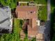 Aerial top-down view shows roof with skylights and greenery that includes a wooden deck at 2929 E 62Nd St, Indianapolis, IN 46220