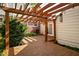 Cozy wooden back deck featuring a charming pergola, perfect for outdoor relaxation and entertaining at 2929 E 62Nd St, Indianapolis, IN 46220