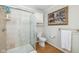Well-maintained bathroom featuring a glass shower, toilet, and decorative artwork at 2929 E 62Nd St, Indianapolis, IN 46220