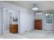 Bright bedroom features white walls, a ceiling fan, and a mini split system at 2929 E 62Nd St, Indianapolis, IN 46220