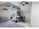 Bedroom with white wood paneling, striped bed, and decorator shelves at 2929 E 62Nd St, Indianapolis, IN 46220