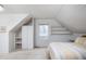 Bedroom with white wood paneling, built in storage, and a striped bed at 2929 E 62Nd St, Indianapolis, IN 46220
