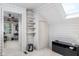 White wood paneled room with desk, shelves, and doorway to other bedroom at 2929 E 62Nd St, Indianapolis, IN 46220