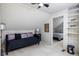 Bedroom with white wood paneling, black futon, and stairway at 2929 E 62Nd St, Indianapolis, IN 46220