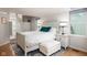 Bright bedroom featuring a large bed, matching nightstands, and plenty of natural light from the windows at 2929 E 62Nd St, Indianapolis, IN 46220