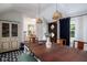 Inviting dining room showcasing an wooden table and access to the kitchen and other rooms at 2929 E 62Nd St, Indianapolis, IN 46220