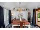 Charming dining room with a wooden table, pendant lighting, and decorative shelving at 2929 E 62Nd St, Indianapolis, IN 46220