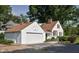Exterior view of the garage featuring a large two car garage door, and attached home at 2929 E 62Nd St, Indianapolis, IN 46220