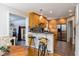 Kitchen view from the breakfast nook, with countertop bar, and stainless steel appliances at 2929 E 62Nd St, Indianapolis, IN 46220