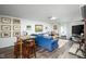 Spacious living room with a blue sofa and exposed brick fireplace at 2929 E 62Nd St, Indianapolis, IN 46220