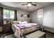 Comfortable bedroom with a ceiling fan, modern gray walls, and natural light from the window at 2965 E 1100 N, Pendleton, IN 46064