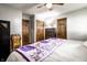 Relaxing bedroom features modern wood floors, a cozy queen bed, and three wooden doors at 2965 E 1100 N, Pendleton, IN 46064