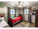 Cozy bedroom featuring a single bed, natural light from the windows and wood-look flooring at 2965 E 1100 N, Pendleton, IN 46064
