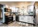 Well-lit kitchen featuring white cabinets, stainless steel appliances, and modern fixtures at 2965 E 1100 N, Pendleton, IN 46064