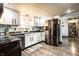 Bright kitchen with stainless steel appliances, sleek white cabinetry, and modern lighting fixtures at 2965 E 1100 N, Pendleton, IN 46064