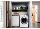 Convenient laundry area equipped with modern washer and dryer and built in shelving at 2965 E 1100 N, Pendleton, IN 46064