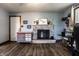 Charming living room featuring a brick fireplace, wood flooring, and decorative elements at 2965 E 1100 N, Pendleton, IN 46064