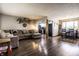 Cozy living room with wood floors and comfortable seating, seamlessly connected to the kitchen at 2965 E 1100 N, Pendleton, IN 46064