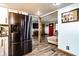 Inviting living room showcases modern stainless steel fridge, wood beam, and an open-concept design at 2965 E 1100 N, Pendleton, IN 46064